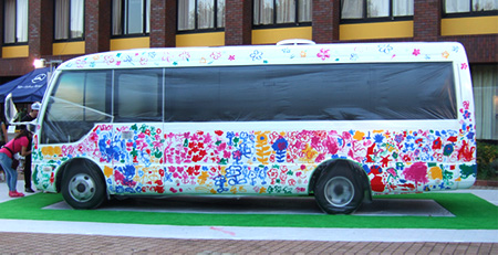 One of the two FUSO Rosa small buses colorfully painted by children at an event held at the Deutsche Schule Tokyo Yokohama in October