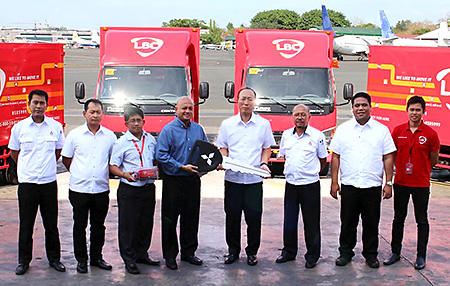 Key handover by Mr. Junya Masuda, EVP for Marketing, MMPC, MFTBC’s local distributor (fourth from right), to Mr. Gerard Payaoan, VP for Systems, Distribution and Delivery, LBC Express (fourth from left)