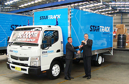 50,000th Canter presented to StarTrack at 9:30 am on Monday, August 5, 2013 From right: Mr. Brett Arandale, Fleet Sales Manager FUSO, handing over the key to Mr. Scott Gardiner, StarTrack Manager Multihaul and Fleet Operations