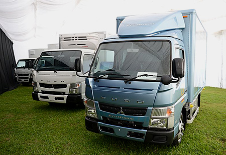Canter (white body) and Canter Eco Hybrid (blue body) light-duty trucks for Singapore